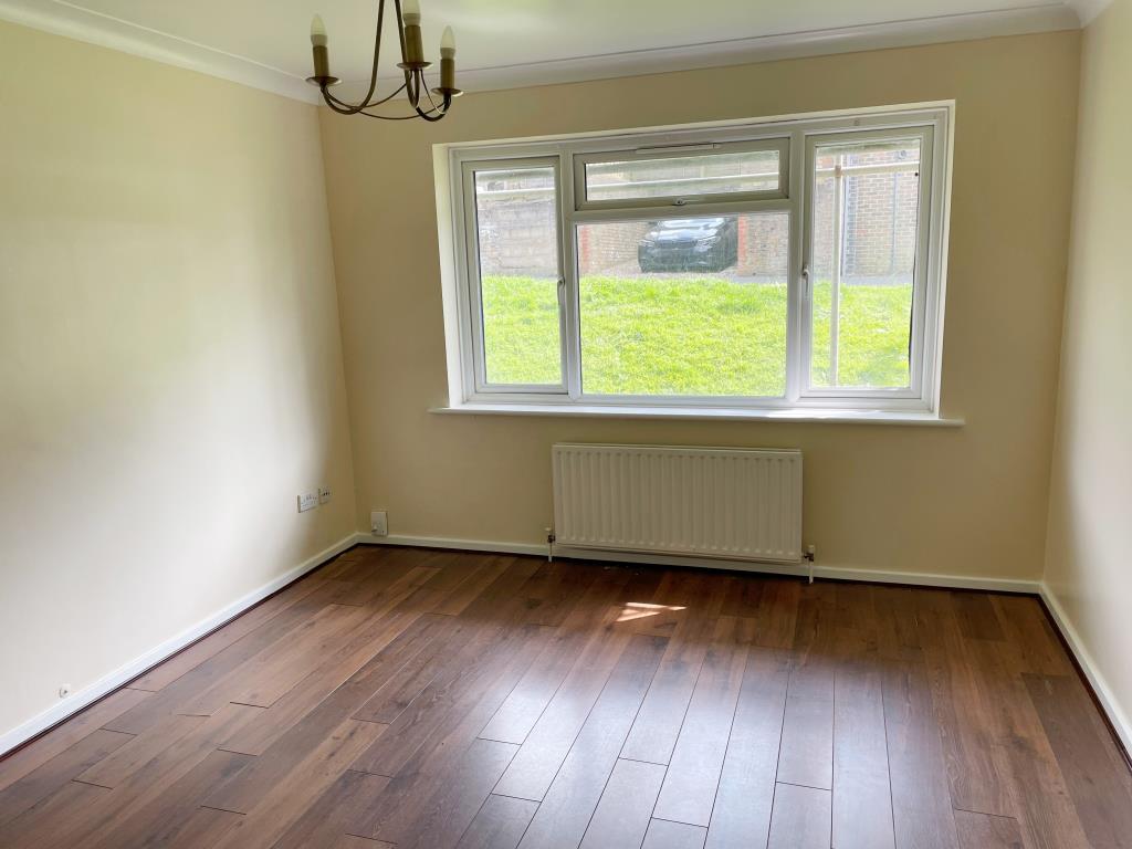 Lot: 151 - TWO-BEDROOM FLAT WITH PARKING - front living room with window overlooking garden area